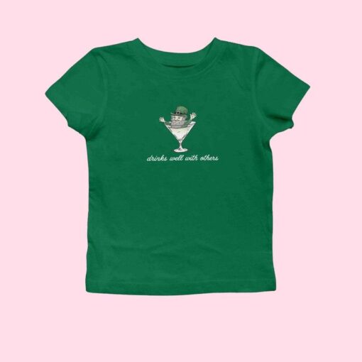 St. Patrick's Day Women’s Baby Tee - Leprechaun Martini Cocktail "Drinks Well with Others" Funny Tee