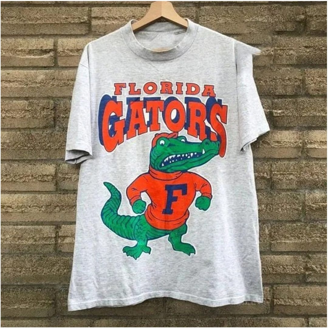 Vintage NCAA Florida Gators Mascot Logo Shirt, University of Florida Hoodie Shirt Gifts for NCAA Fans with Unique Design